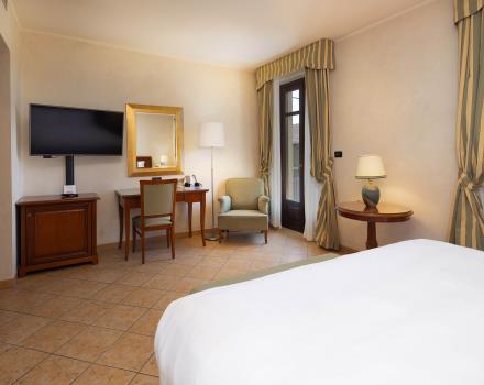 Las habitaciones del Best Western Plus Hotel Le Rondini, cerca  de Turín y su aeropuerto, están diseñadas para envolverte en un ambiente refinado y familiar